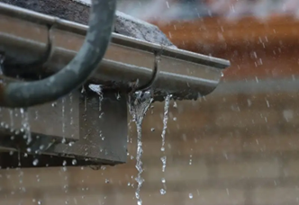 Rusty leaking and holed rain gutter